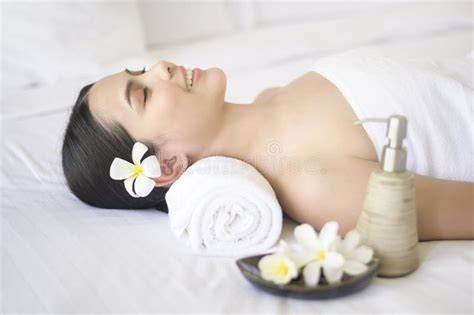 Beautiful Woman Is Relaxing And Having Massage In Spa Resort Massage