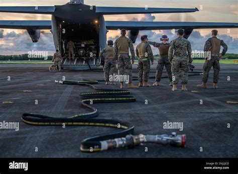 Airmen From The 374th Logistics Readiness Squadron And Marines Stand