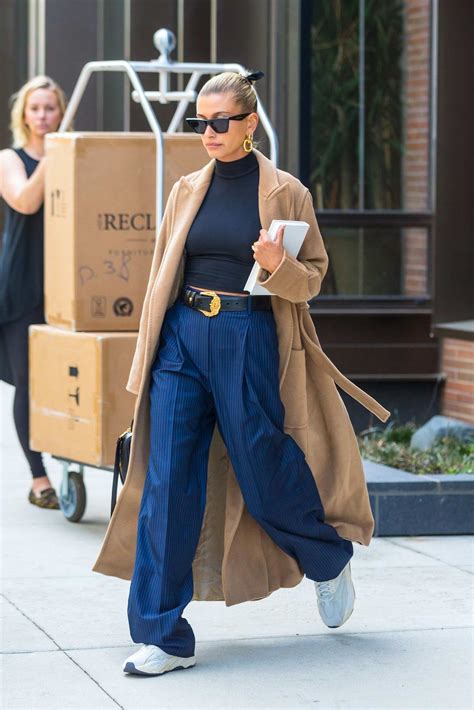 Hailey Baldwin Bieber Looks Chic In A Camel Trench Coat Over A Black