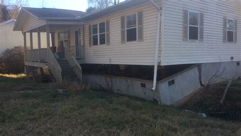 Homes sinking into culvert on Asheville's London Road