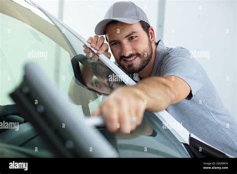 Mature Male Worker Cleaning Car Windshield Stock Photo Alamy
