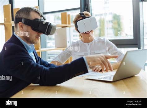 Pleasant Handsome Man Pointing At The Laptop Screen Stock Photo Alamy