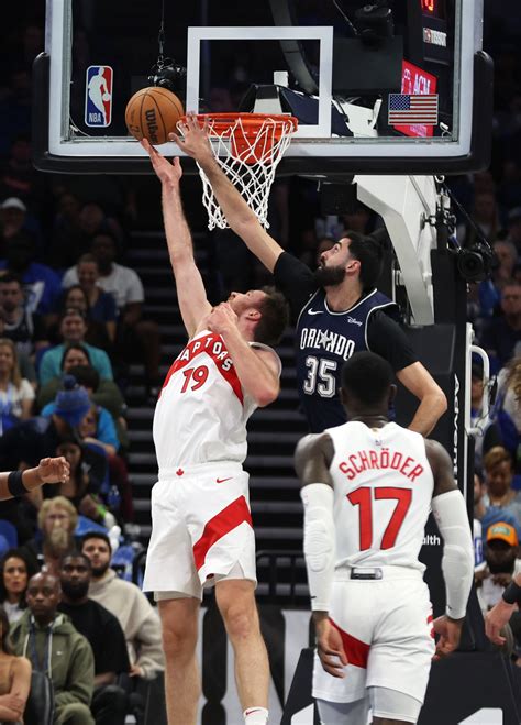 Toronto Raptors Center Jakob Poeltl Shoots As Orlando Magic Center