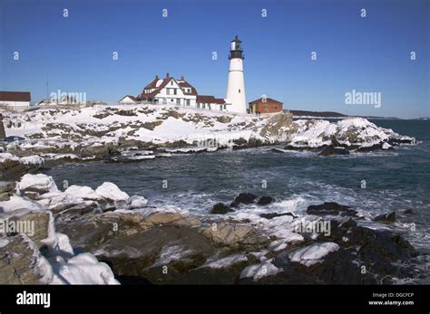 Portland Head Lighthouse with winter snow and ice in January, Portland ...