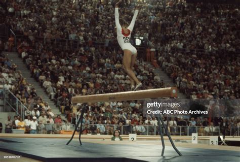 Olga Korbut competing in the Women's balance beam event at the 1972 ...