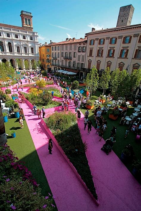 An Aerial View Of A Pink Carpeted Area With Lots Of People