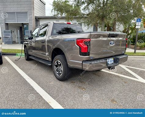 A Ford Lightning Electric Truck Vehicle Charging At A Charging Station