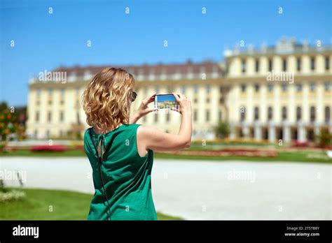 Blonde Tourist Girl Takes Pictures Of Wien Sch Nbrunn Palace On Her Phone On A Sunny Summer