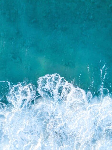 Premium Photo Vertical Overhead Shot Of Clear Blue Ocean Waves