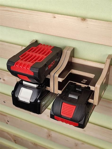 Two Black And Red Tool Boxes Sitting On Top Of Each Other