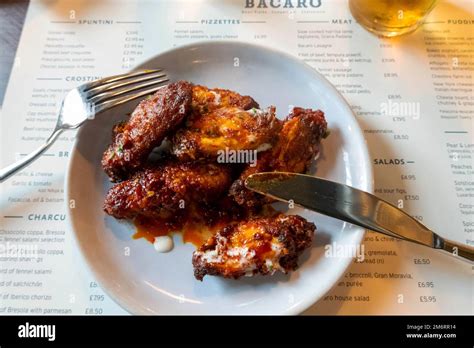 Chicken Wings With A Spicy Sauce At Bacaro Stock Photo Alamy