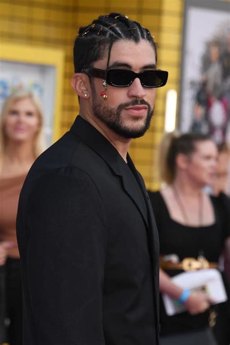 A Man With Dreadlocks On His Head Wearing Sunglasses And A Black Suit