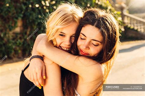 Two Girls Hugging Female Closed Eyes Stock Photo 163538244