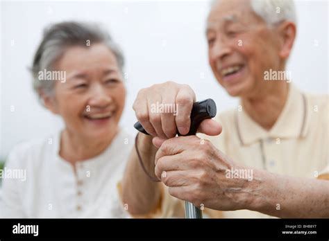 Japan Tokyo Prefecture Senior Couple Smiling Focus On Mans Hand