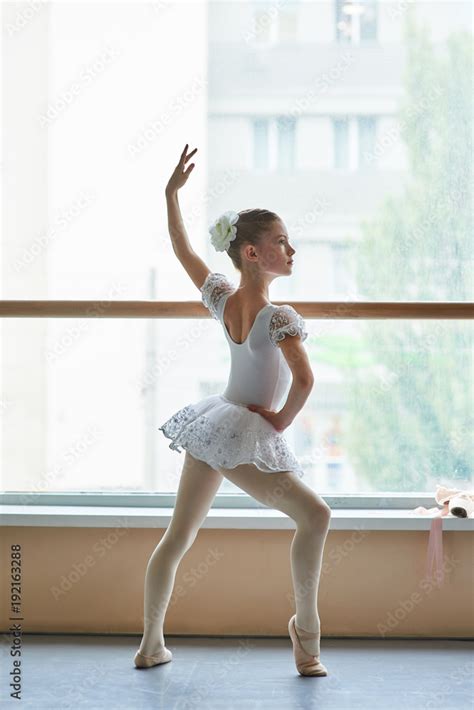 Young ballerina standing in ballet position. Beautiful young ballet ...