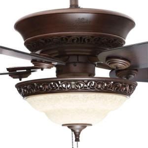 A Ceiling Fan With Two Blades Attached To It S Light Fixture And An