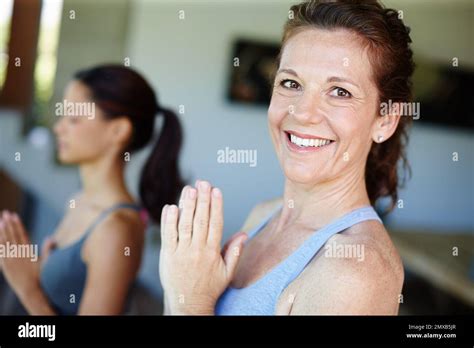 Feeling In The Zone An Attractive Mature Woman Smiling While Attending