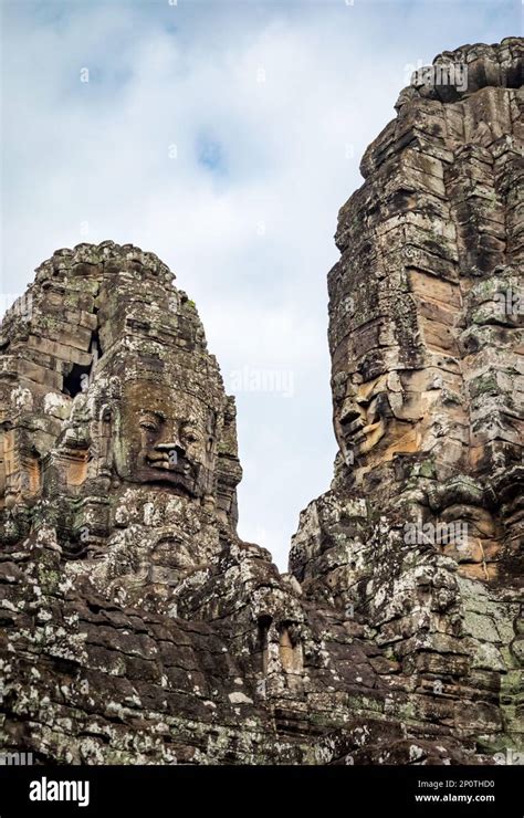 Giant Carved Stone Faces Are Seen On The Towers Of The Ruins Of The