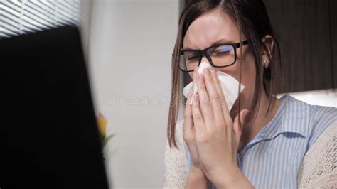 Girl Blows Her Nose Attractive Woman Working On Laptop Typing Breaks And Blows Her Nose In