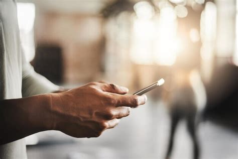 Premium Photo Cropped Hand Of Man Using Mobile Phone