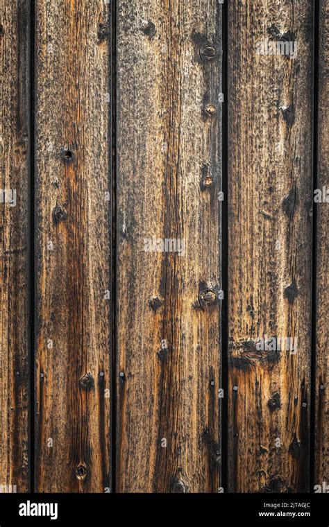A vertical shot of aged weathered wood texture perfect for background ...