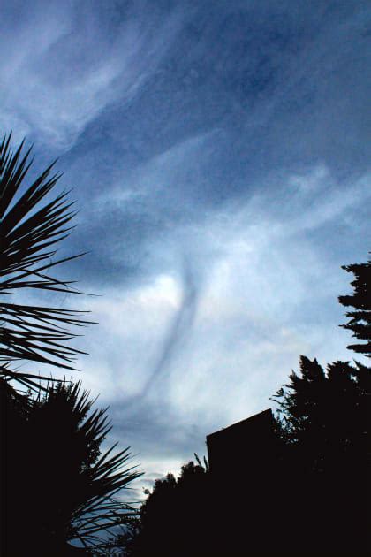 Funnel Cloud Forms Over Hills Northwest Of Gisborne