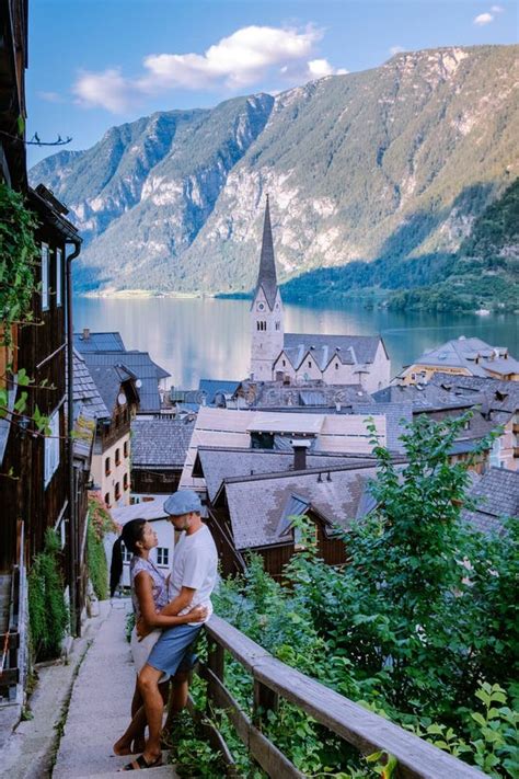 Couple Visit Hallstatt Village On Hallstatter Lake In Austrian Alps