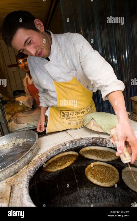 Fresh Nan Naan Bread Is Baked In The Tandoor Clay Oven In Xinjiang
