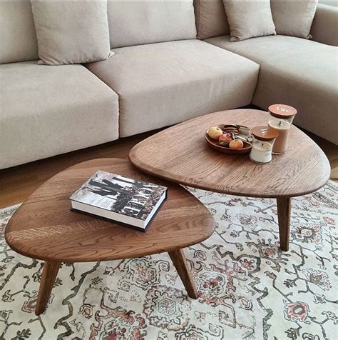 A Coffee Table Sitting On Top Of A Rug Next To A Couch