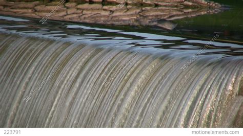 Closeup Of Waterfall Flowing Over Edge In Lines High Definition Stock