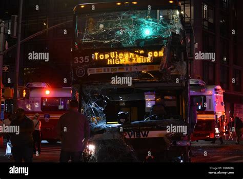 Investigators Surround The Double Decker Tour Bus Involved In The