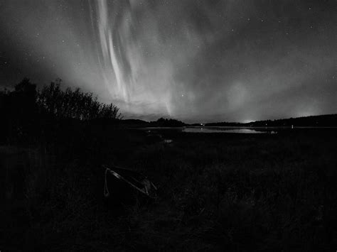 The boat under the sky. Aurora borealis September 2023 22 bw Photograph by Jouko Lehto - Pixels