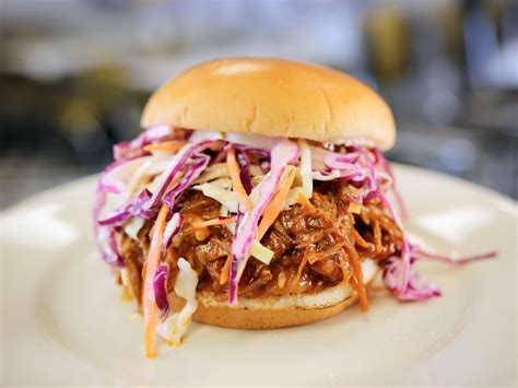 Delicious Pulled Pork Sandwich With Bbq Sauce And Coleslaw