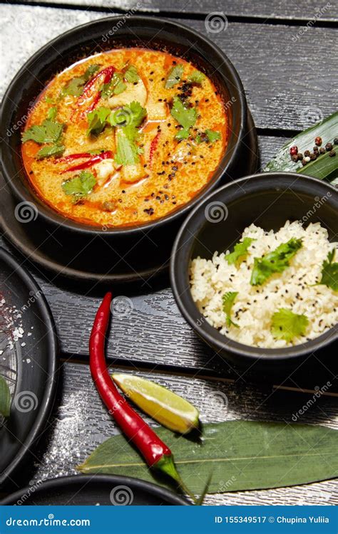 Asian Dish On A Black Plate Tom Yum With Rice Stock Image Image Of