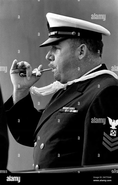 A Boatswain S Mate 1st Class Pipes The First Watch During The Commissioning Ceremony Aboard The