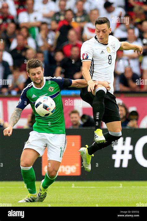 Northern Ireland S Oliver Norwood And Germany S Mesut Ozil Right