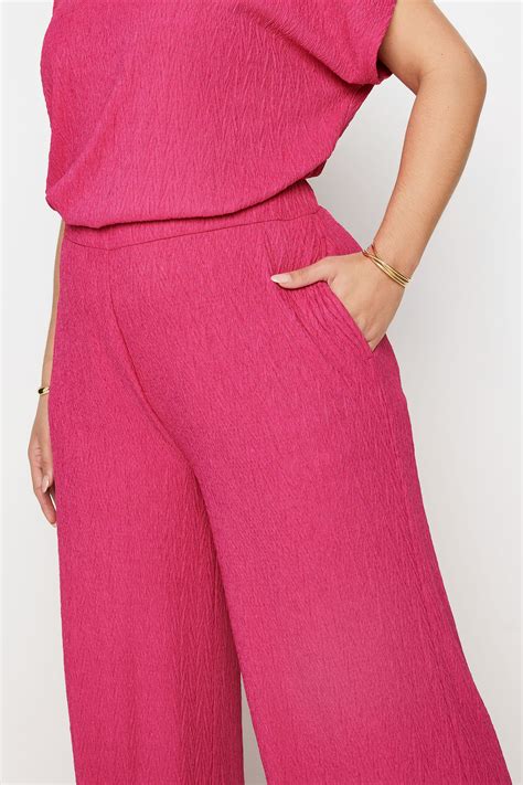 Yours Plus Size Pink Crinkle Plisse Wide Leg Trousers Yours Clothing