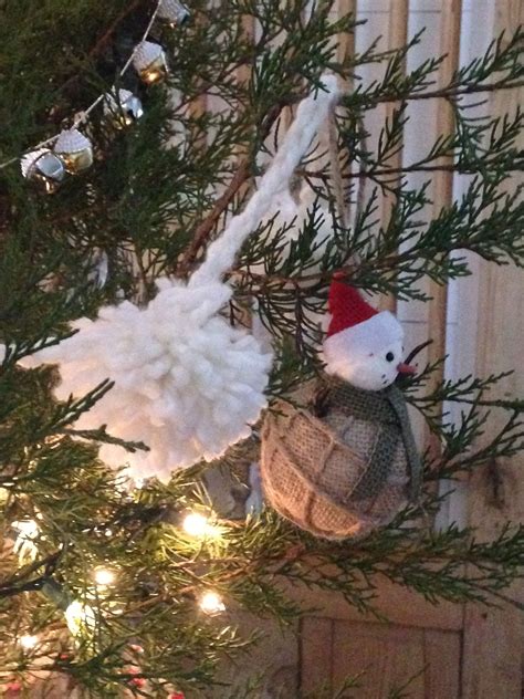 Pompon garland on a cedar Christmas tree