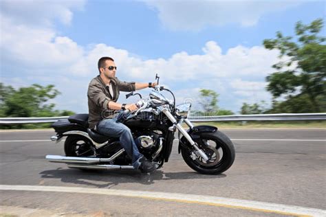 Download Young Man Riding A Motorcycle On An Open Road Stock Image - Image: 19779883