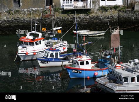 Polperro Harbour With Moored Fishing Boats Stock Photo Alamy