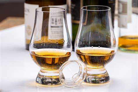 Tasting Of Whiskey Tulip Shaped Tasting Glasses With Dram Of Scotch