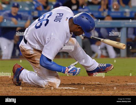 Los Angeles Dodgers Yale Puig Falls To One Knee After Swinging For A Strike Before Hitting A