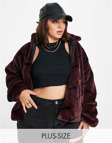 Nike Plus All Over Swoosh Faux Fur Jacket In Burgundy Crush And Black