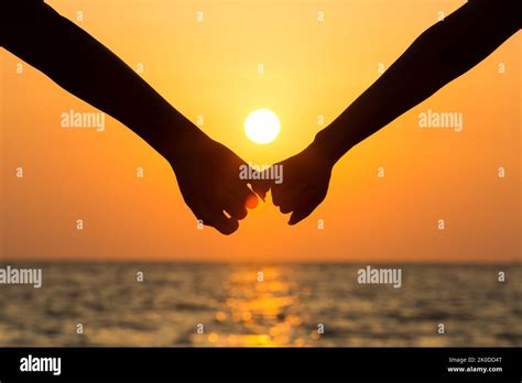 Happy Couple Holding Hands On Beach Stock Photo Alamy