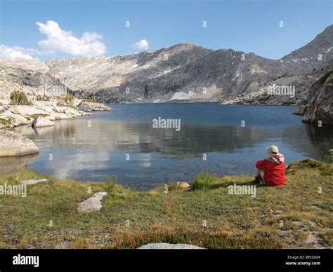 A Hiker Overlooks 10568 Three Island Lake In The John Muir Wilderness