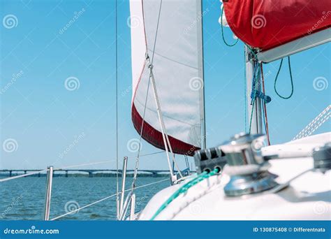 Sail Of A Sailing Boat Against Blue Sky Stock Photo Image Of Fabric