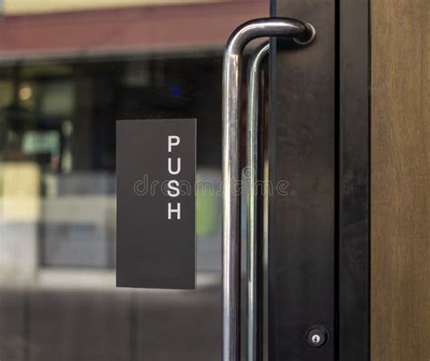 Restaurant Door Handle With Push Sign On Glass Doors Stock Photo