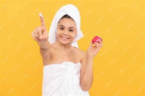 Premium Photo Happy Teen Girl In Shower Towel Apply Facial Cream