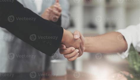 Image Of Successful Businessmen Partnership Handshaking After