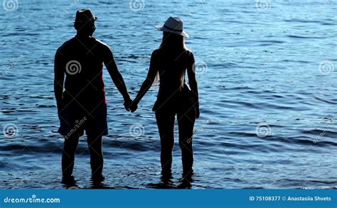 Silhouette Couple Holding Hands At Sunset On Beach Stock Video Video